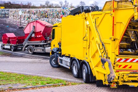 Urban recycling waste and garbage services. the garbage truck works.