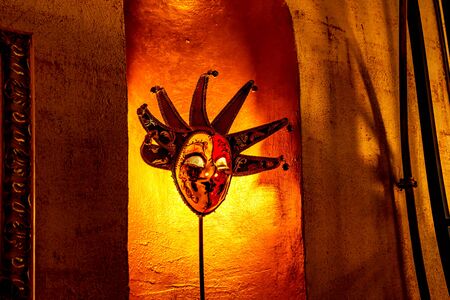 Elegant venetian mask. Royal mask in castle on wallの写真素材