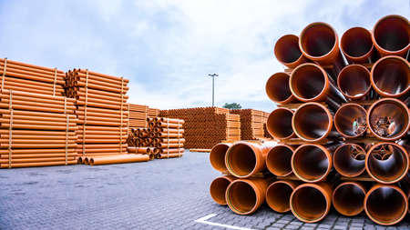 Orange PVC pipes. logistics warehouse