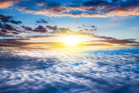 Pink clouds of sunset Sun. Beautiful heavenly landscape with the sun in the clouds.の写真素材