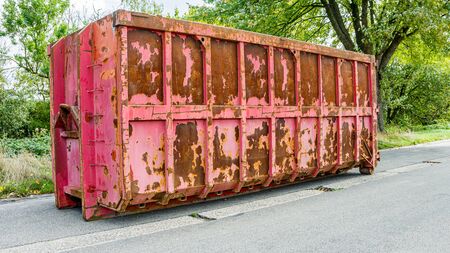 Disposal and recycling dumpster. A large, metal, garbage container and municipal waste.の写真素材