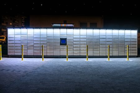 Electronic Locker, automated parcel terminal (parcel locker, post terminal,) on the street with...