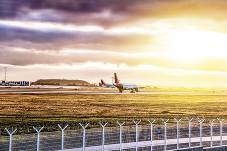 Aircraft take-off into the sky against the background of the airportの写真素材