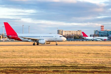 Aircraft take-off into the sky against the background of the airportの写真素材