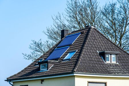 Vacuum solar water heating system on the roof of the houseの写真素材