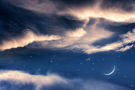 a young month in the clouds. background generous Ramadan
