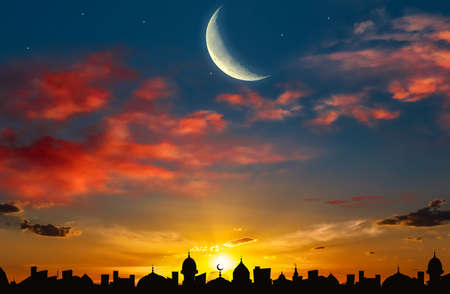 Mosque silhouette. a young month in the clouds. sunset sky.の写真素材