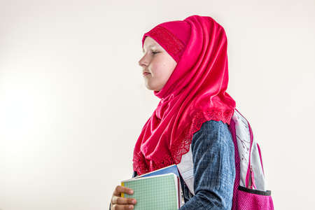Teenage Muslim Arabic girl    ,    school-age child on white backgroundの写真素材