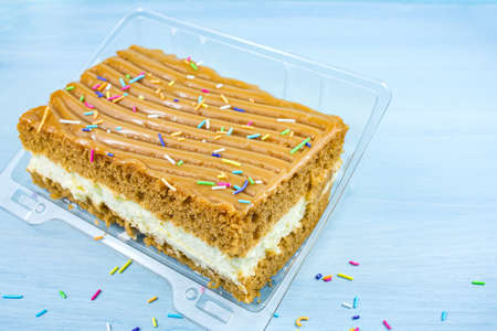 dessert cake with brown cakes and white filling