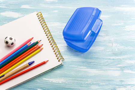School supplies on a blue background.
