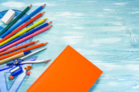 School supplies on a blue background.