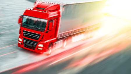 Motion blurred trucks on highway. Transportationの写真素材