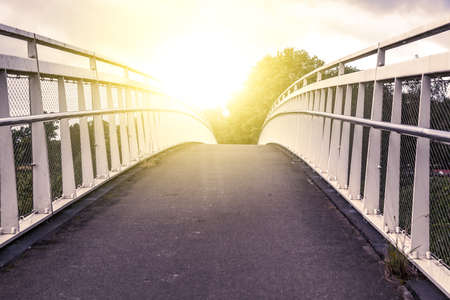 road on the bridge opposite sunlightの写真素材