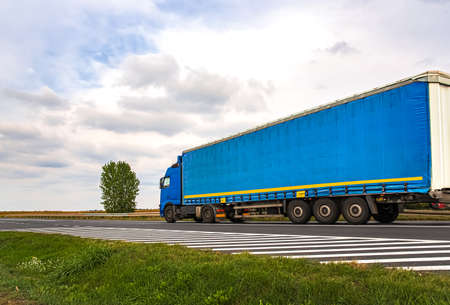 Motion blurred trucks on highway. Logistics and transportation