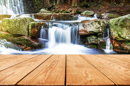 table in front of the waterfall, natural backgroundの写真素材