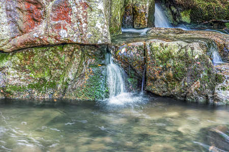 waterfall in the forest, clean natural flow of water