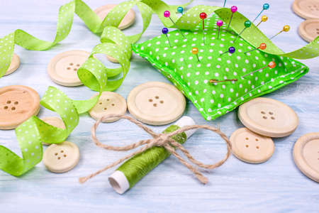 buttons on the table with pins and ribbons, Sewing accessories dressmakerの写真素材