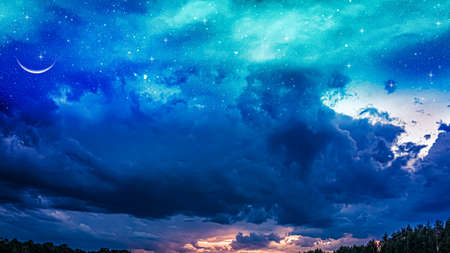 Ramadan background with a crescent and sunset sky. beautiful dawn in the morningの写真素材