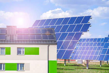 alternative energy background. lots of apartment building with solar panels, green energy