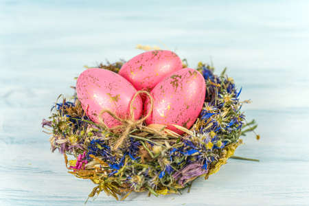 happy Easter, different color egg in the nest