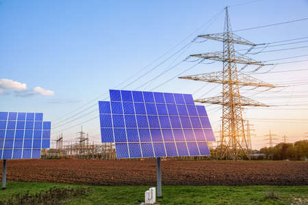 Solar panels with electric pole.の写真素材