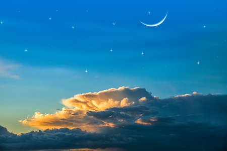 crescent in cloudy sunset, sky backgroundの写真素材