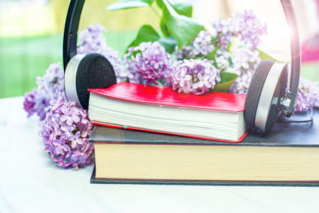 Audio book and headphones on the tableの写真素材