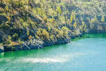 Abandoned mining quarry. The mines are filled with water. A small lake in a quarry, extracting...