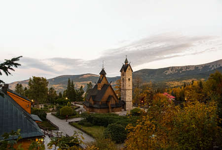 Old wooden Church against the backdrop of the Polish mountains