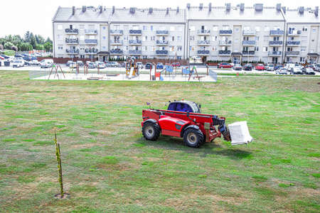 loader transports building materials in the city