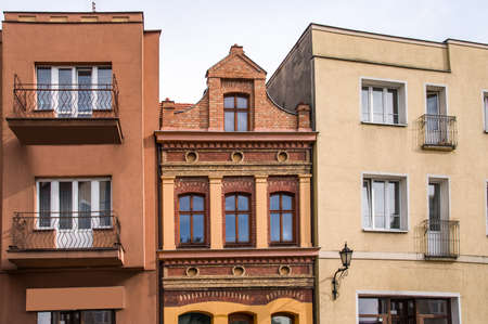 Facade of an old residential building on the street of the city, the historical center of Poland