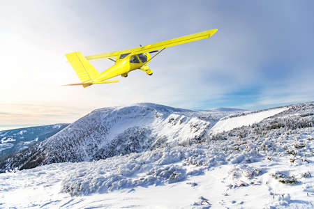 Plane against the background of Winter mountain landscapesの写真素材