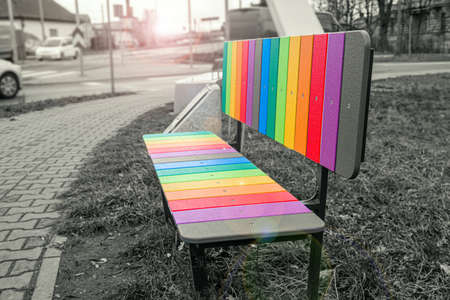 The colors of the rainbow LGBT are isolated against the gray background of the cityの写真素材