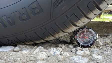 chronograph Tissot under the wheels of a car Krasnodar,Russia-20.06.2020.