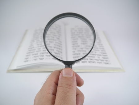 Magnifying glass and a bookの写真素材