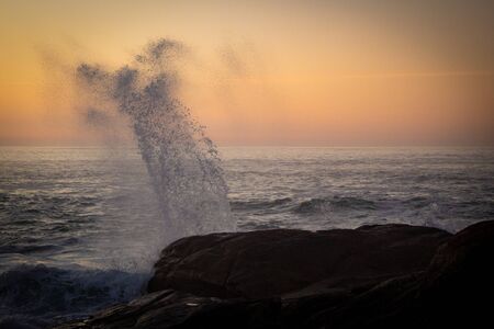 Breakwater during the sunset in Oia, Galicia (Spain)