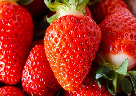 Fresh Strawberries. Seasonal, juicy fruit. Dessert ingredient. Strawberries in the basket. Red fruits. Soft food. Macro picture.の写真素材