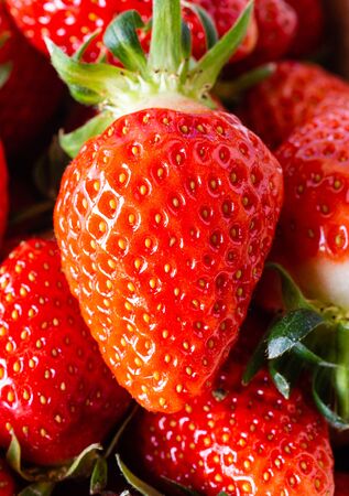 Fresh Strawberries. Seasonal, juicy fruit. Dessert ingredient. Strawberries in the basket. Red fruits. Soft food. Macro picture.の写真素材