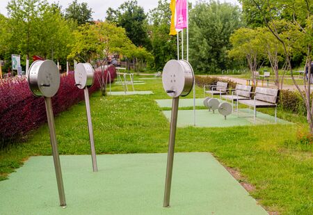 Outdoor gym. Aerobic exercise. Gymnastics in the city park. Sport is health. Gymnastic intervals. Healthy lifestyle. Municipal greenery. Playground.の写真素材
