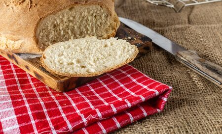 Homemade bread. Homemade pastries. Breads on the kitchen table. Tasty and healthy. Fresh bread for vegetarians. Bread with wheat flour.の写真素材