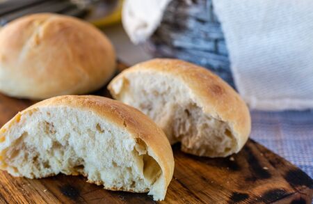 Fresh wheat buns. Homemade bread. Home cooking. Family breakfast. Fragrant bread rolls. Cooking together. Perfect for breakfast.の写真素材