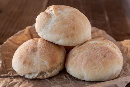 Fresh wheat buns. Homemade bread. Home cooking. Family breakfast. Fragrant bread rolls. Cooking together. Perfect for breakfast.の写真素材