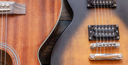 Electric guitar body. Music equipment on old boards. Two humbuckers. Wooden body. Metal stringsの写真素材