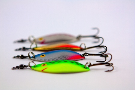A close up of some colourful lures with some out of focusの写真素材