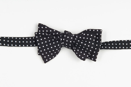 an excellent black dotted bow-tie, suited to any kind of shirt. Isolated on white backgroundの写真素材