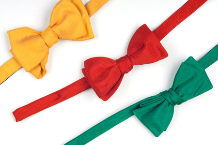 Yellow, red and green bow-ties lift your spirits all the time. Isolated on white background