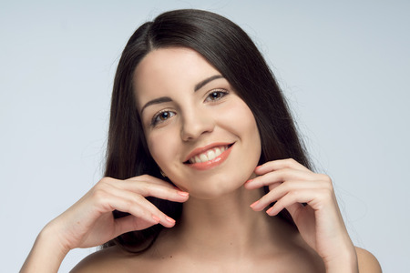 Pretty young girl with unbelievable great smile, isolated on the white backgroundの写真素材