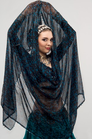 Full length portrait of mysterious oriental woman with tempting look  Isolated on the white backgroundの写真素材