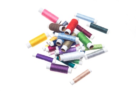 Nice heap of many-colored threads must be in your shopping list  Isolated on the white backgroundの写真素材