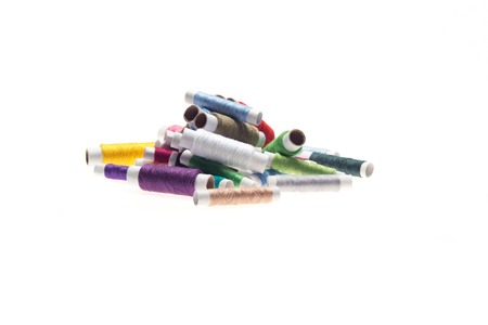 Nice heap of many-colored threads must be in your shopping list  Horizontal photo  Isolated on the white backgroundの写真素材